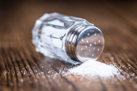 Old,Wooden,Table,With,A,Salt,Shaker,(close-up,Shot;,Selective