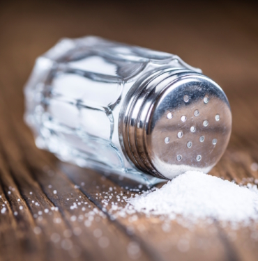 Old,Wooden,Table,With,A,Salt,Shaker,(close-up,Shot;,Selective