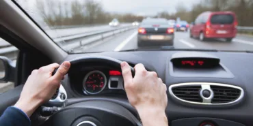 Driving,Car,On,Highway,,Close,Up,Of,Hands,On,Steering