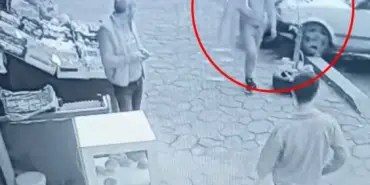 OTOMOBİLİN ALTINDA KALMAKTAN SANİYELERLE KURTULDU, RAHAT TAVIRLARI DİKKAT ÇEKTİ