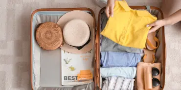 Woman,Packing,Suitcase,At,Home.,Travel,Concept