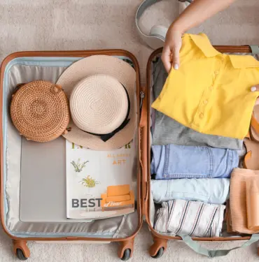 Woman,Packing,Suitcase,At,Home.,Travel,Concept